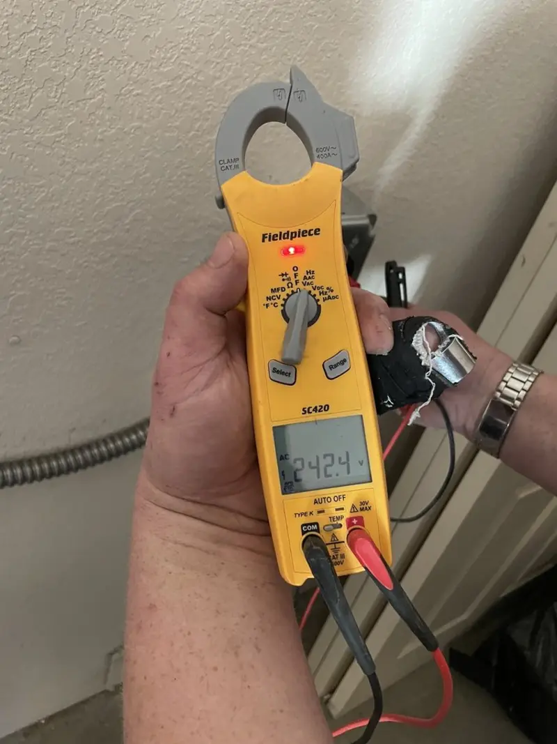 Voltage testing with clamp meter during Generator Installation in Bethany